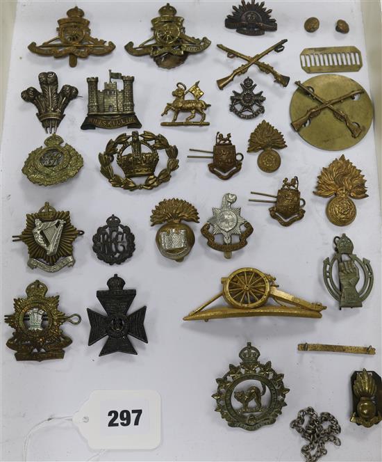A collection of twenty five assorted cap and other uniform badges and two small buttons